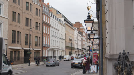 People-Walking-Past-Office-Buildings-In-Grosvenor-Street-Mayfair-London-2